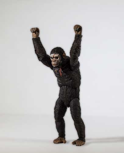 Caesar the ape with arms up in victory